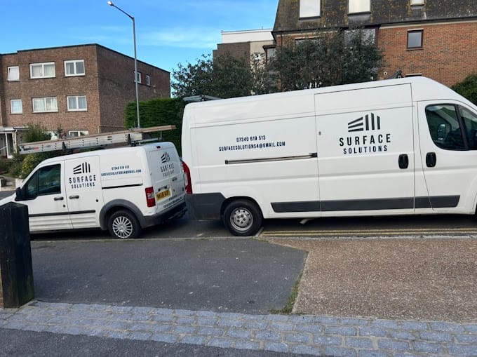 2025-03-05 An image of 2 vans owned by Surface Solutions